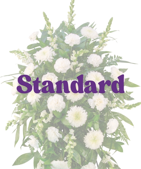 White Promises funeral stand with all-white carnations, spider mums, snapdragons, and greenery on a standing easel – Billy Heroman’s Baton Rouge
