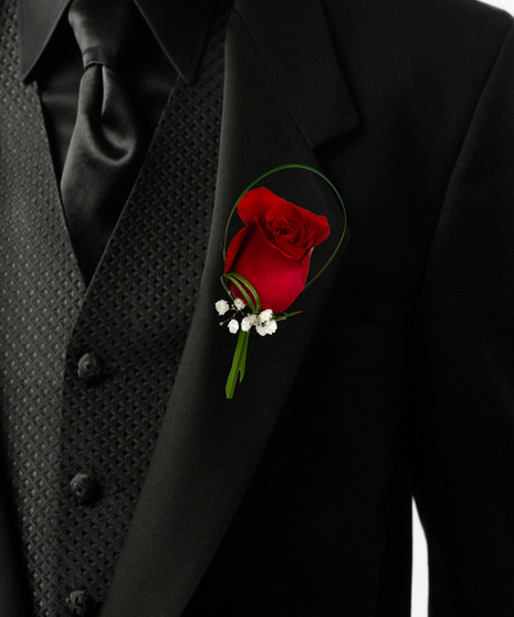 an elegant single rose bouttonière