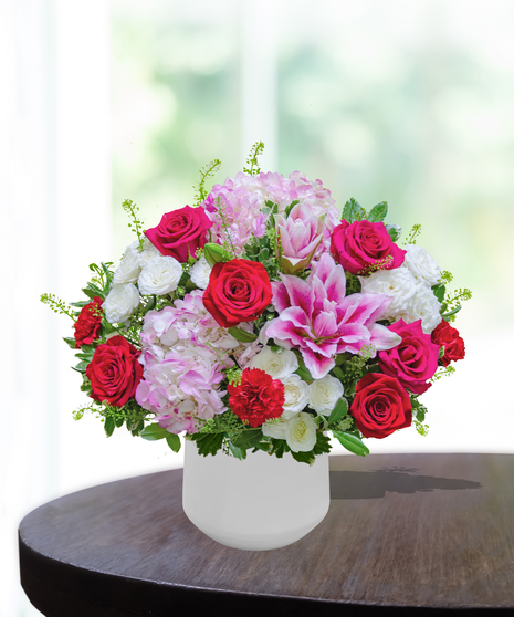 Ruby Spice flower arrangement by Billy Heroman’s, featuring rich red and pink blooms, perfect for July birthdays.