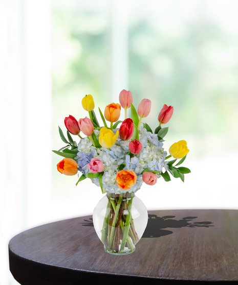 Tulip Treasures Flower Arrangement for Mother's Day: A stunning display of vibrant tulips in a chic vase