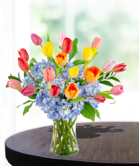 Tulip Treasures Flower Arrangement for Mother's Day: A stunning display of vibrant tulips in a chic vase